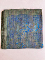 Teal cotton square scarf woven with sparkly lurex threads and a blue printed pattern